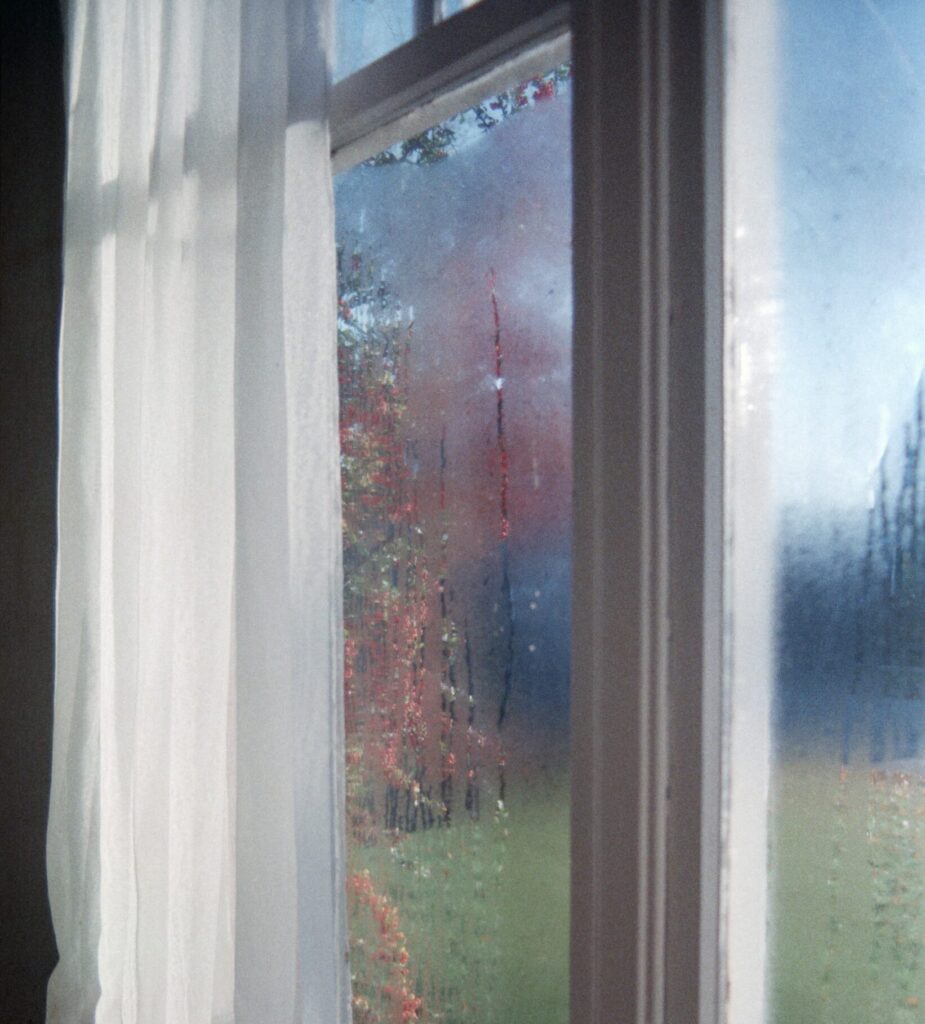 Close view on residential window with condensation and fog between the glass panes.